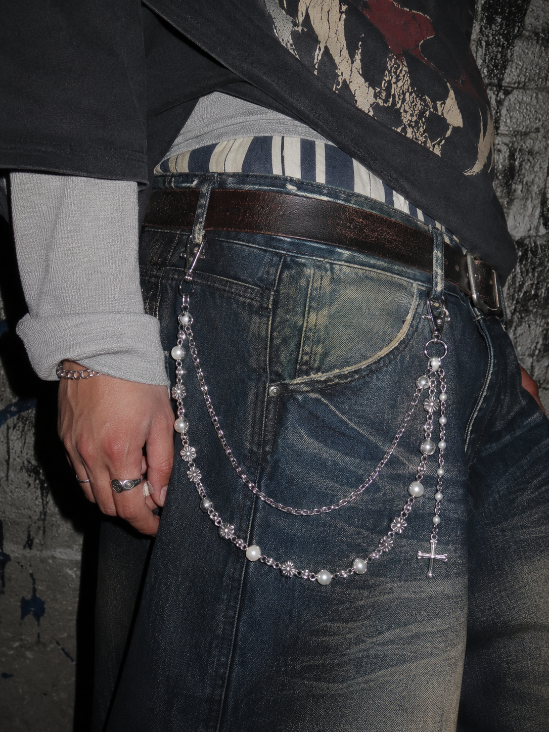 ADRN 03 Flower Silver pants chain worn laterally on heavily washed blue denim